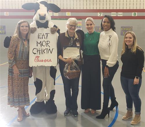 Proviann Martinn (center, holding certificate) Substitute of the Month